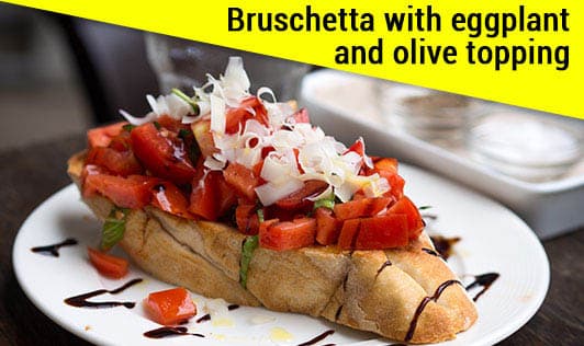 Bruschetta with eggplant and olive topping